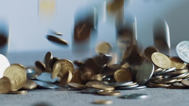 Closeup-slow-motion-dropping-coins