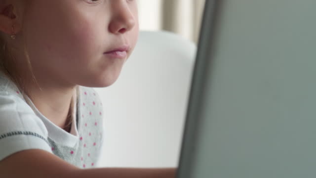 Little-Girl-Using-Touchscreen-on-Laptop