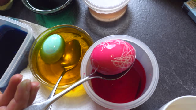 Easter-Egg-Painting-in-Red-and-Orange-Water