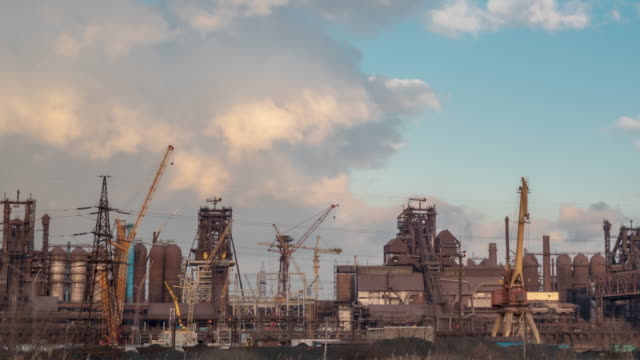 Industry-factory-at-the-cloudy-time.-Timelapse-4K