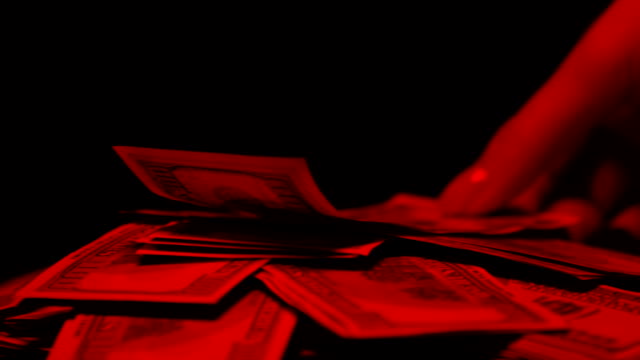 Money-in-red-lights,-womans-hand-taking-dollar-banknote,-prostitution-concept