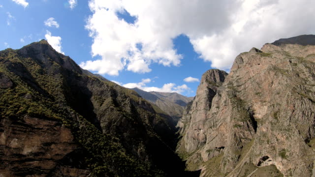 Timelapse-gorge-cliffs-with-moving-sky-shadows-and-clouds.