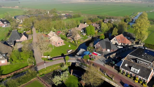 Aerial-view-small-beautiful-village-in-Holland.-Flying-over-the-roofs-of-houses-and-streets-of-a-small-village-in-Holland.