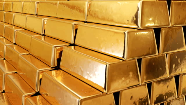 Golden-Bullions-in-a-Mountain-of-Gold-Seamless.-Looped-3d-Animation-of-Beautiful-Gold-Bars-Growing-High-with-Yellow-Reflections.-Banking-and-Wealth-Concept.
