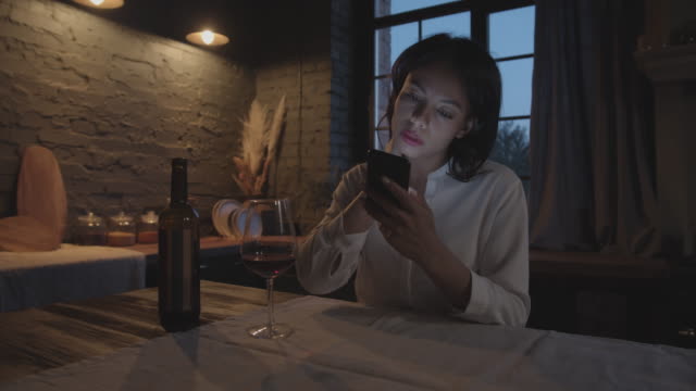 Young-Woman-Drinking-Wine-in-the-Evening