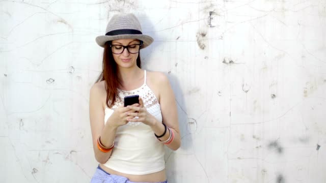 Stylish-young-woman-obsessed-with-checking-social-media
