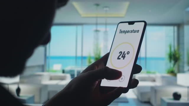 Turn-off-house-security-on-smart-home-app-on-the-smartphone.-Mobile-application-for-Home-Automation-and-smart-home-technology---Temperature-adjustment