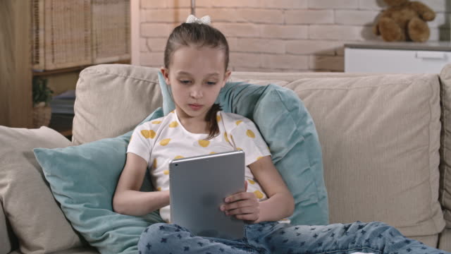 Girl-Browsing-Net-on-Tablet