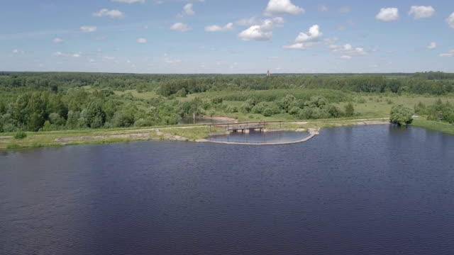 Aerial-shot-of-the-dam.-The-wide-river-becomes-narrow.