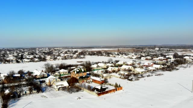CHERKASY-REGION,-UKRAINE,-DECEMBER-25,-2018:-winter,-snow-covered-streets,-houses.-frosty-sunny-day.-aero,-view-from-above