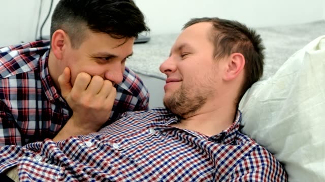 Men-gay-lie-down-together-and-flirt-each-other.