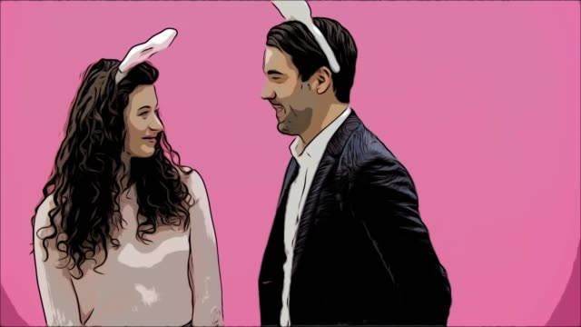 Young-sexy-couple-on-pink-background.-With-bunny-ears-on-the-head.-During-this-man-gives-a-soft-toy-with-a-hare-to-his-wife.-Having-kissed,-looking-at-the-camera.-Animatoin.