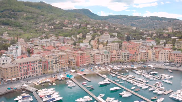 aerial-view-of-municipality-Santa-Margherita-Ligure-in-summer-day,-white-yachts-are-moored-in-small-bay
