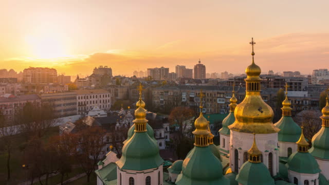 Aerial-view-of-Kyiv-city,-St.-Sophia-Cathedral-at-sunset,-Ukraine.-Panoramic-cityscape,-4k-time-lapse