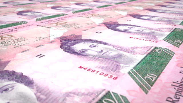 Banknotes-of-twenty-Venezuelan-bolivars-rolling-on-screen,-cash-money,-loop