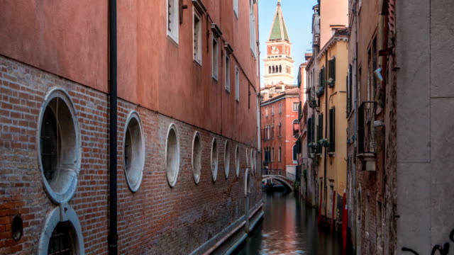 Canal-in-Venice-timelapse.-Channel,-bridges,-historical,-old-houses-and-boats.-Venice,-Italy