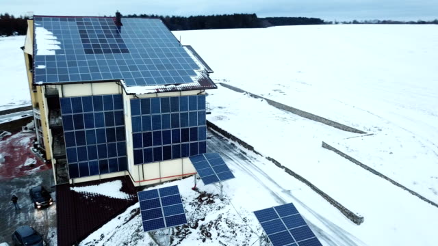 Aerial-solar-farm-low-flight-in-winter.