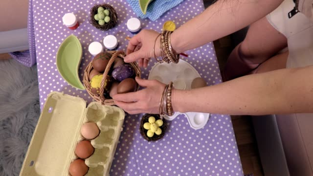 Woman-sorting-Easter-eggs