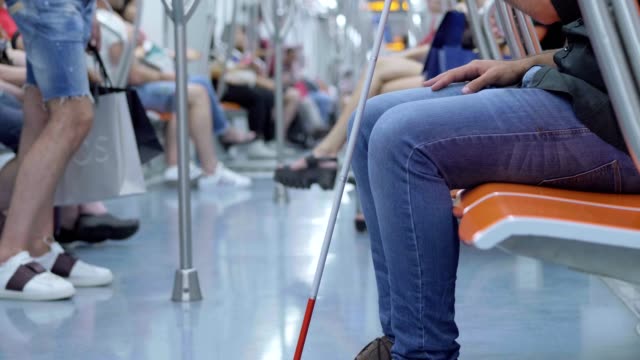close-up-on-legs-and-stick-of-blind-man-in-metro-wagon--slow-motion