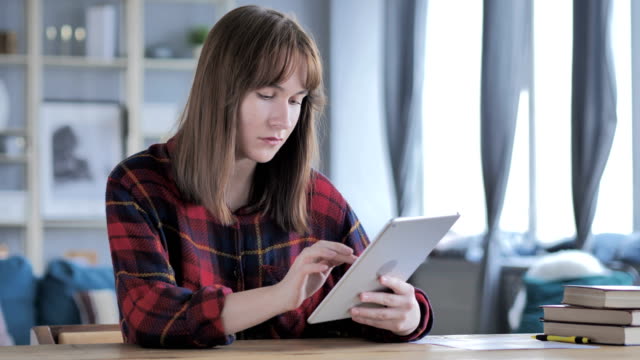 Casual-Young-Woman,-Girl-Browsing-Internet-on-Tablet