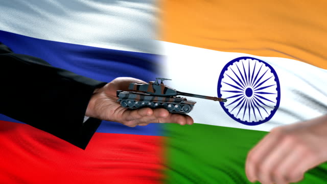 Russia-and-India-officials-exchanging-tank-for-money,-flag-background-protection