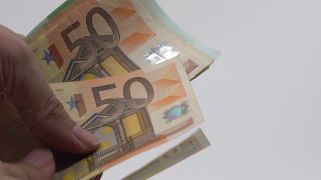 Slow-motion-Close-up-of-hands-counting-euros-bills-of-fifty.-Count-money