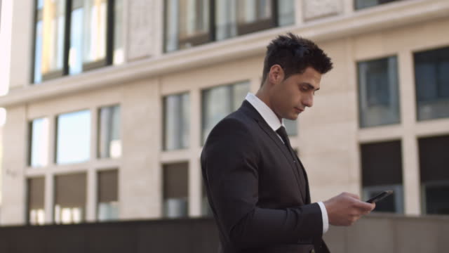 Handsome-Businessman-Using-Phone