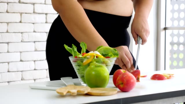 large-build-woman-cooking-diet-healthy-food