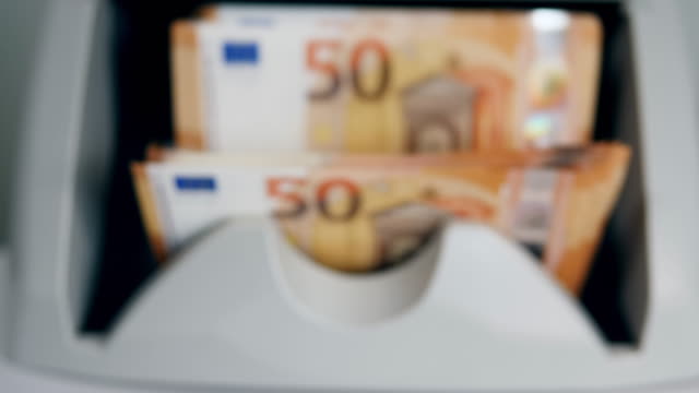 Calculating-machine-is-counting-euro-banknotes