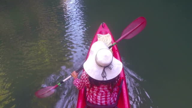 Woman-Kayaking-In-Lagoon-Top-Angle-View-Action-Camera-POV-Of-Girl-Paddling-On-Kayak-Boat