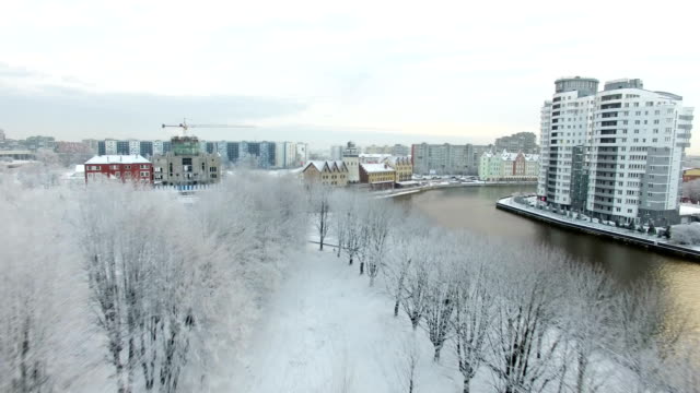 Aerial:-Snow-capped-Fishing-Village-of-Kaliningrad,-Russia
