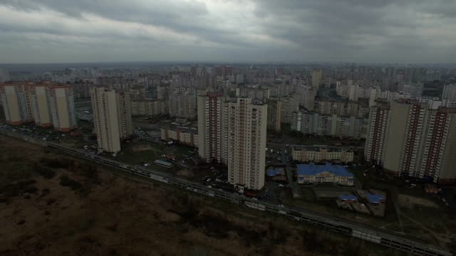 Aerial-drone-footage-of-gray-urban-city-outskirts-with-identical-houses