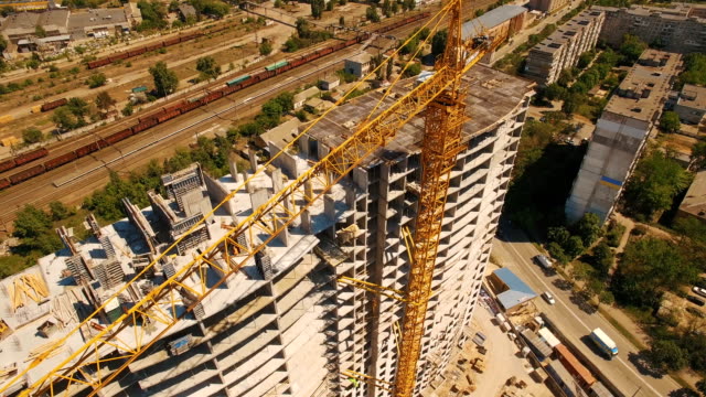 Aerial-shoot-of-construction-site-with-tower-cranes.-Construction-drone-footage