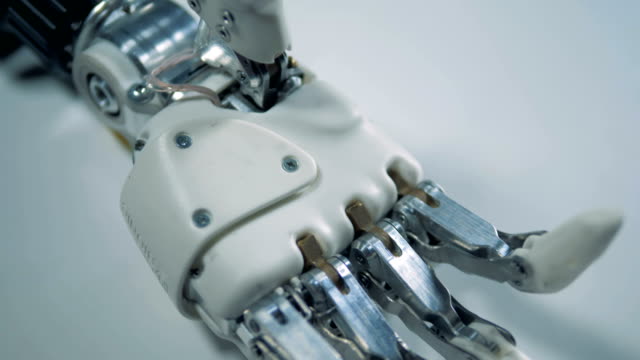 White-surface-with-a-motionless-robotic-arm-on-it