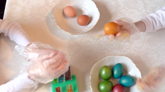 Children-paint-Easter-eggs