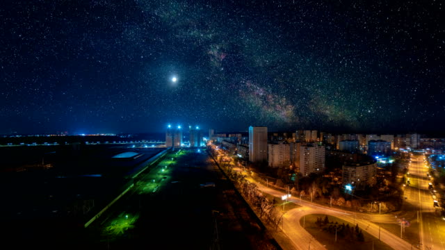 The-starry-sky-above-the-night-city.-time-lapse