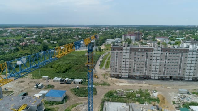 Aerial-view-big-construction-crane-on-a-building-background,-close-up.