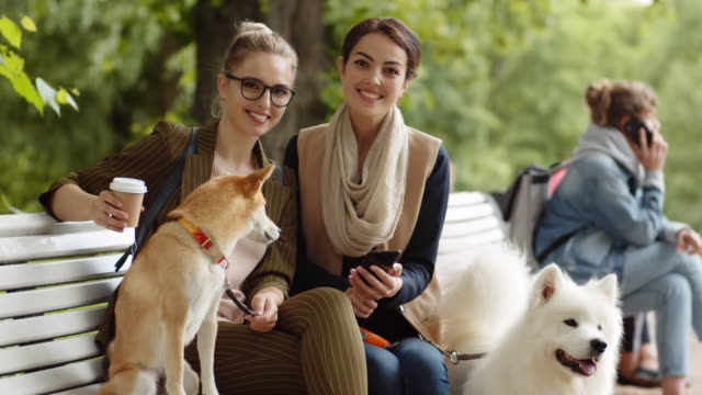 Two-Female-Friends-with-Dogs