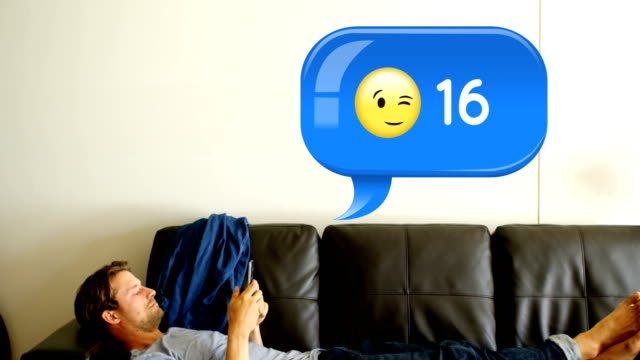 Man-lying-on-a-couch-while-texting-4k