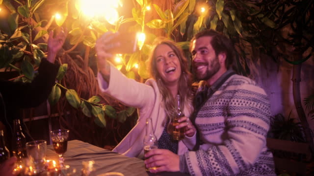 Close-up-caucasian-couple-taking-selfie-with-smartphone-on-patio