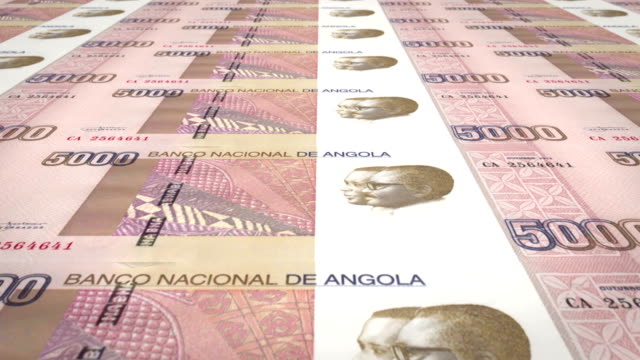 Banknotes-of-five-thousand-angolan-kwanza-of-the-central-bank-of-the-Republic-of-Angola-rolling-on-screen,-coins-of-the-world,-cash-money,-loop