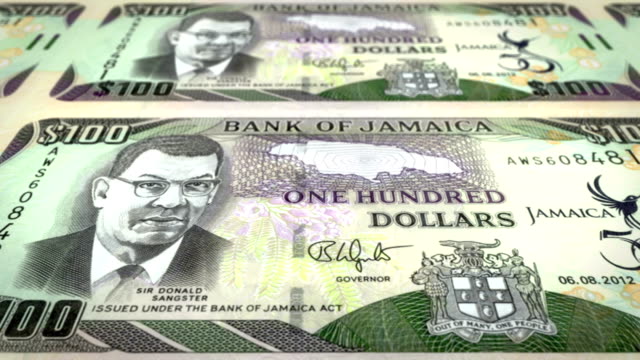 Banknoten-von-hundert-jamaikanische-Dollar-von-Jamaika-Rollen,-Bargeld,-Schleife