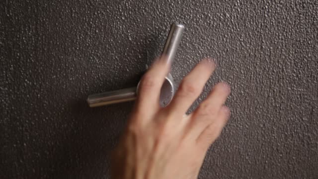 Spinning-a-safe-handle-to-open-its-door