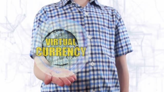 Joven-muestra-un-holograma-del-planeta-tierra-y-texto-Moneda-Virtual