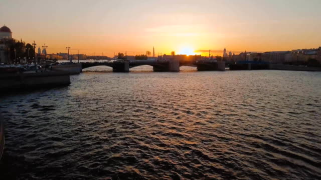 Aerial-view-of-sunset-over-Neva-river-in-Saint-Petersburg,-Russia.-Vasilievskiy-island-city-from-above,-cinematic-drone-video,-historical-buildings-of-nothern-capital