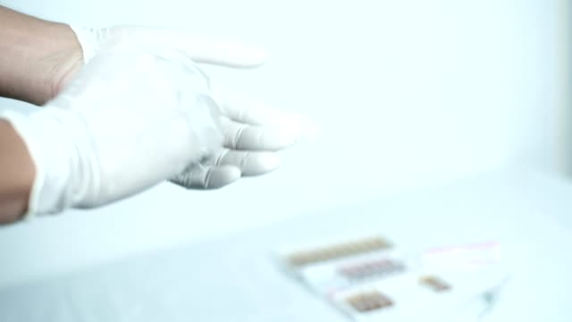 The-doctor-removes-rubber-gloves-after-treating-patients-in-laboratory,-medical-and-healthcare.Vaccination-concept.-Healthcare,-hospital-and-medical-diagnostics.