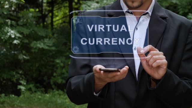 Empresario-utiliza-holograma-con-texto-Moneda-virtual
