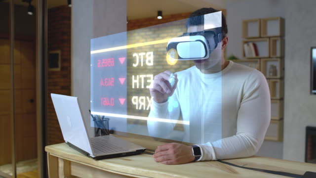 Man-examining-financial-stats,-working-with-futuristic-projection-in-a-vr-set