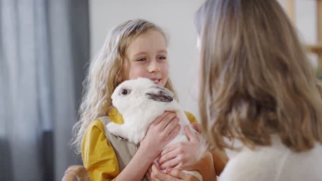 Cute-Girl-Holding-Bunny