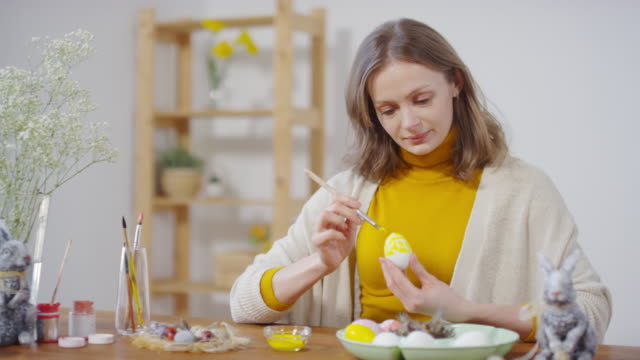 Sequence-of-Woman-Decorating-Egg-for-Easter